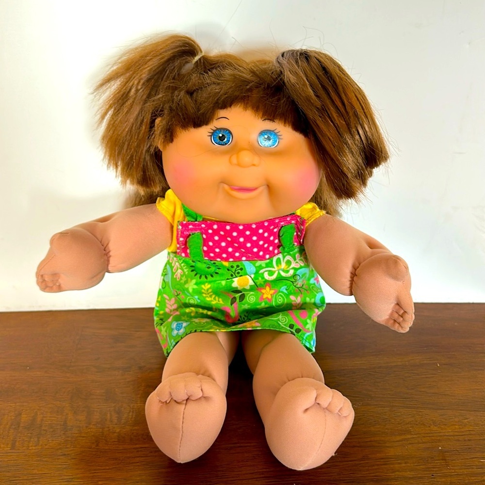 Cabbage Patch Doll With Pig Rail and Green Dress